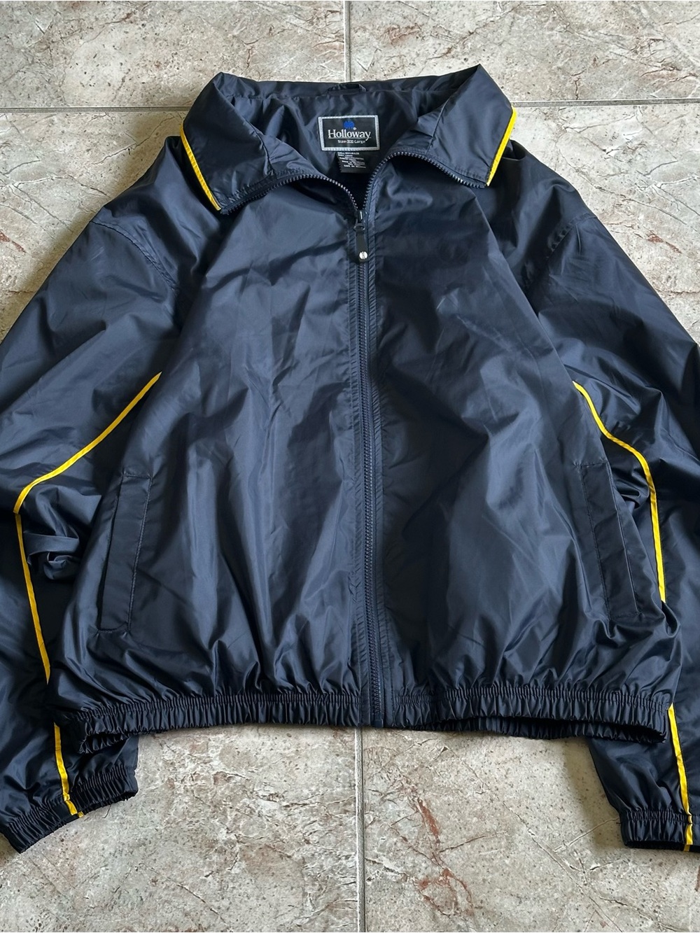 Vintage Holloway navy blue nylon windbreaker with yellow piping.